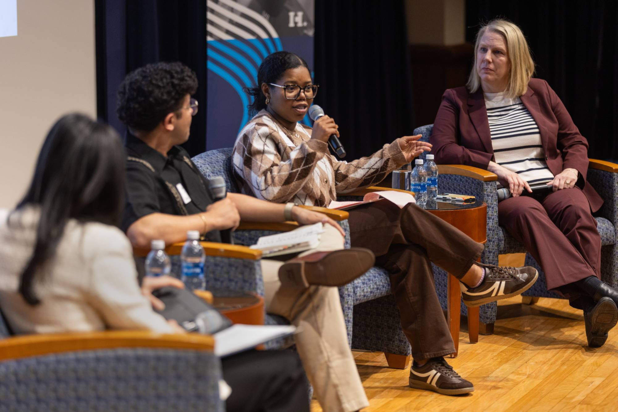 Conversation between participants on stage